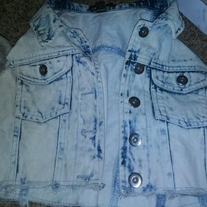 A sleevless jean jacket